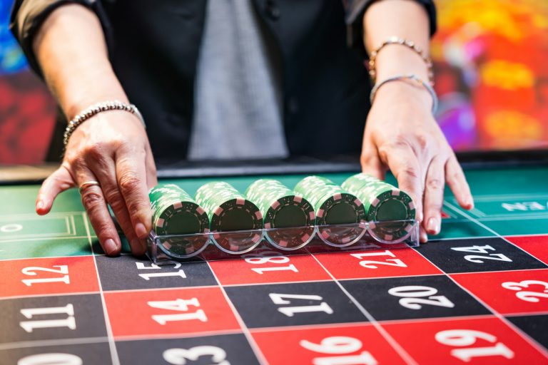 Woman playing roulette at the casino